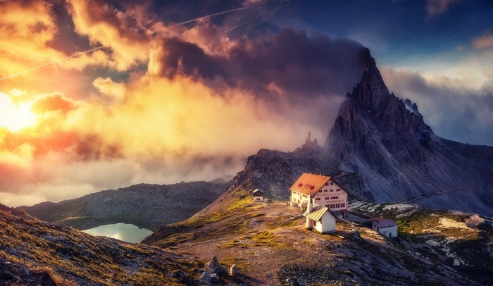 Sunset over a mountain cabin in the Alps
