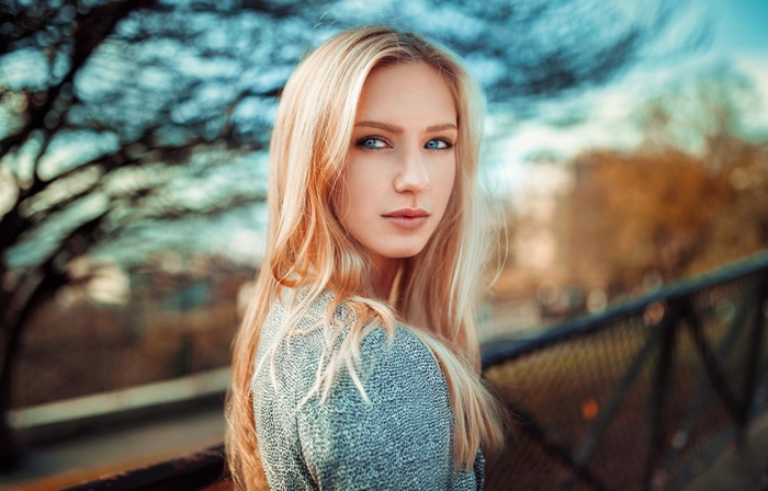 Blonde woman with blue eyes outdoors