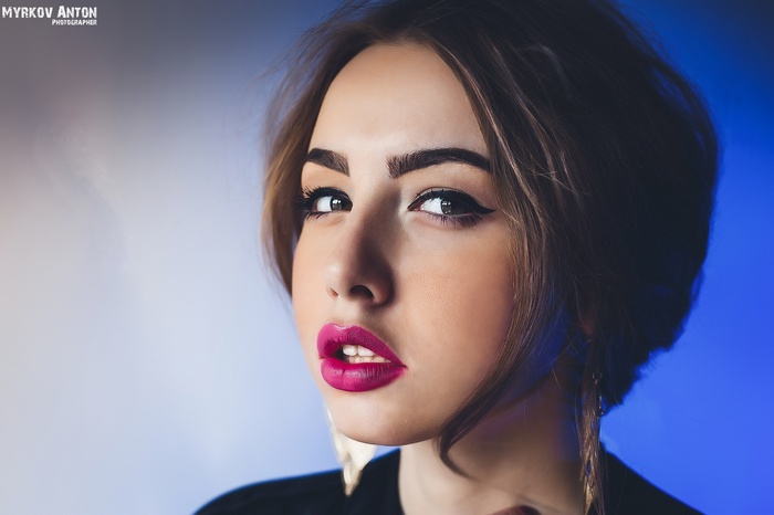 Portrait of a woman with bright pink lipstick by Anton Myrkov