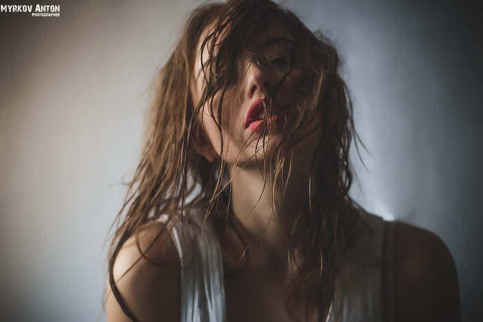Woman with wet hair and red lipstick