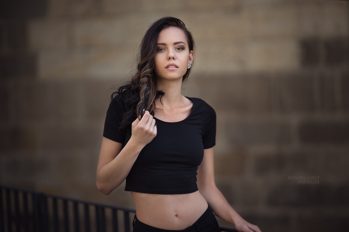 Woman in black crop top outdoors