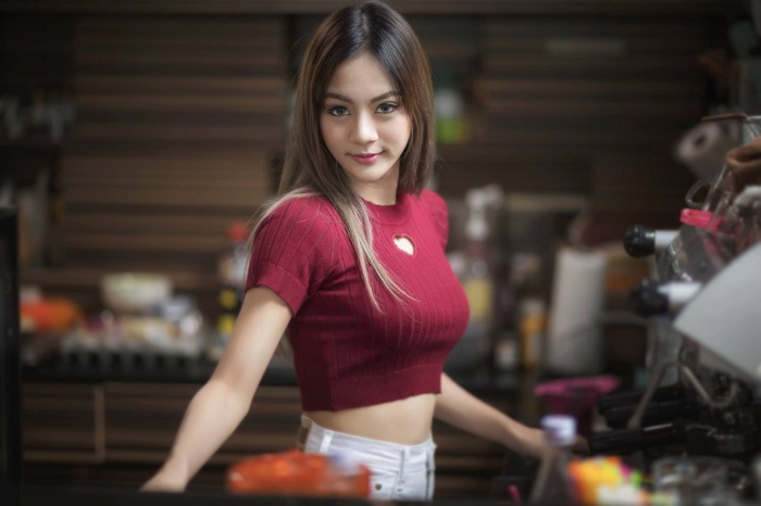 Young Asian woman in a red crop top in Thailand