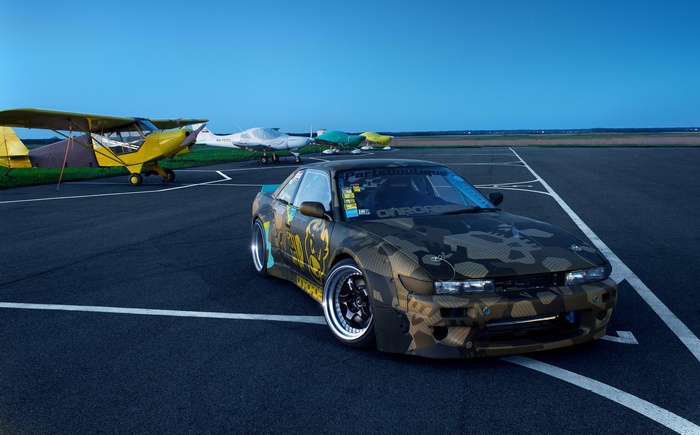 Nissan Silvia S13 with camouflage wrap at an airport