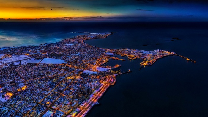 Aerial view of Reykjavik, Iceland at sunset with snow