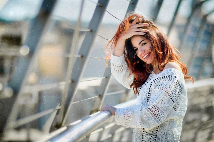 Delaia Gonzalez smiling with hand in hair