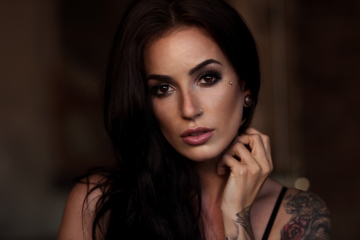 Portrait of a woman with tattoos and piercings