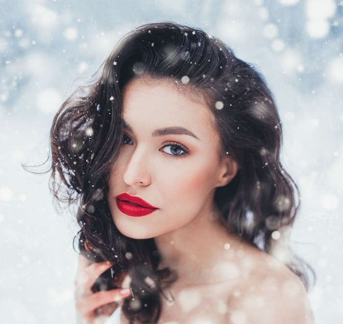 Woman with red lipstick in the snow