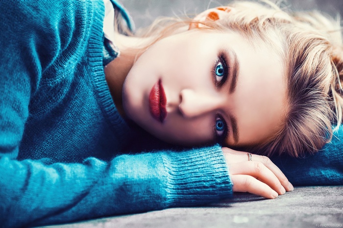 Portrait of a woman with blue eyes and red lipstick