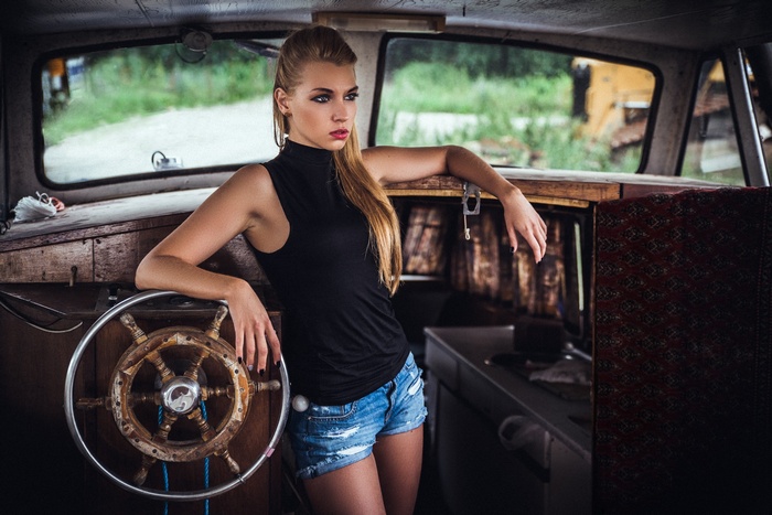 Woman in jean shorts on a boat