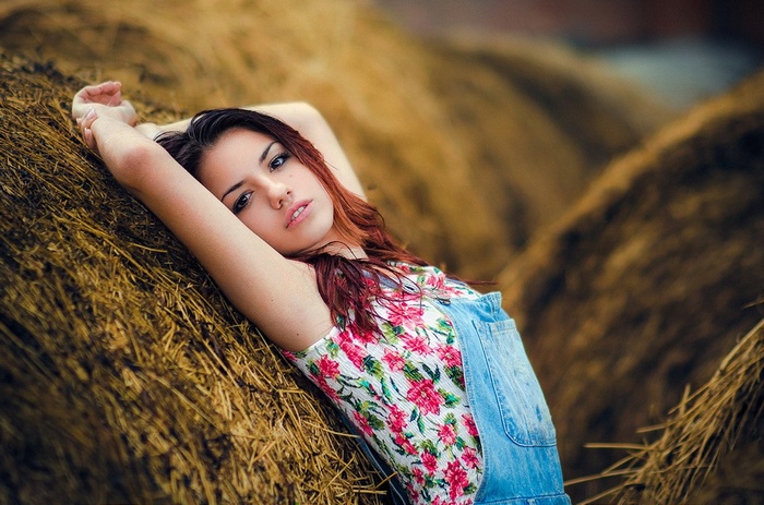 Delaia Gonzalez posing on hay bales