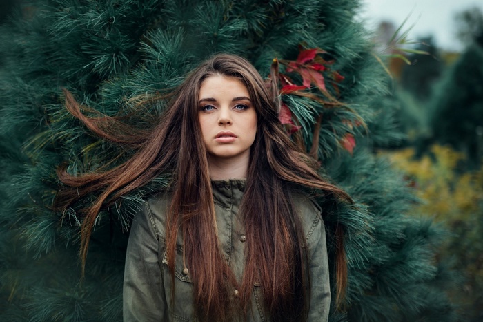 Jesse Herzog in front of a pine tree