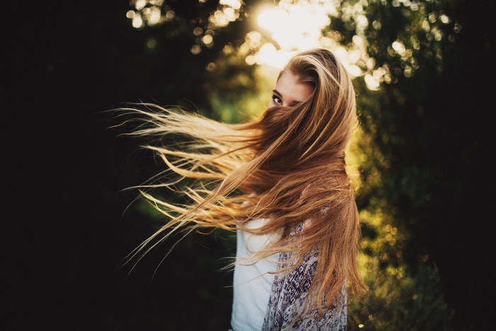 Woman with long hair blowing in the wind