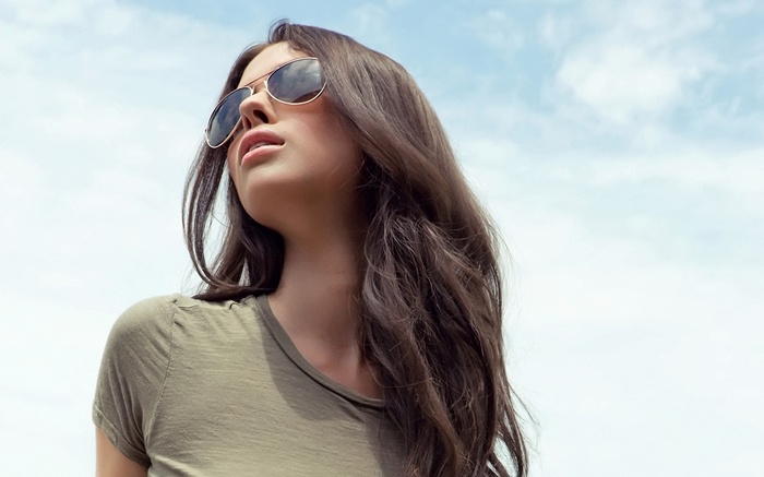 Laura Christie wearing sunglasses against a blue sky