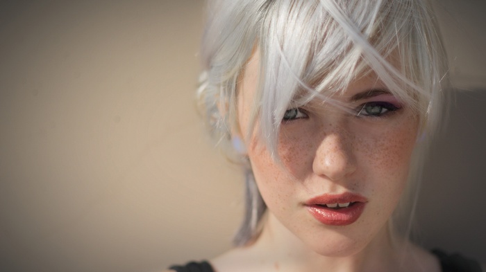 Devon Jade with platinum blonde hair and freckles