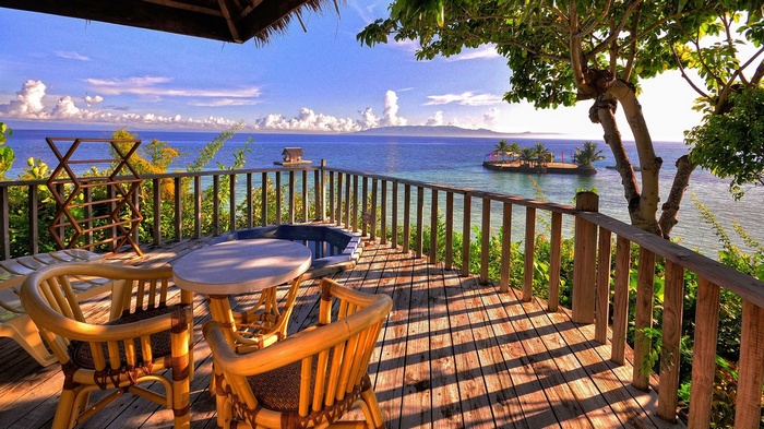 Balcony overlooking the Pacific Ocean with a small island