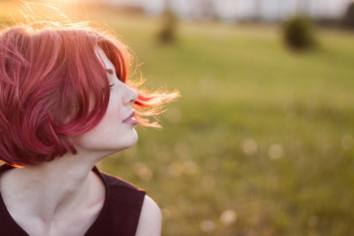 Mayya Giter with red hair in the sun