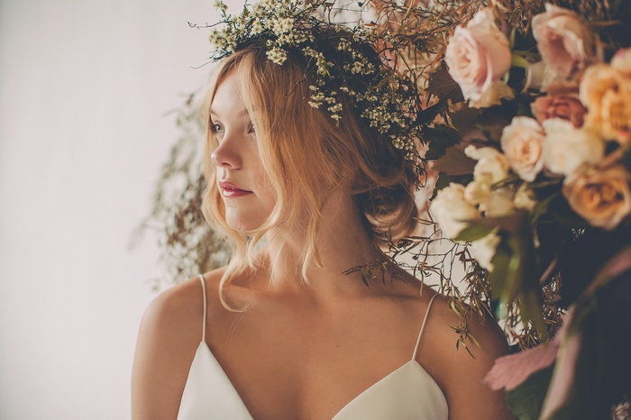 Blonde woman with flower crown and white dress