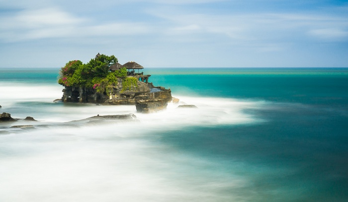 Tanah Lot Temple on a rocky island in the sea