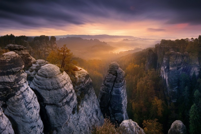 Saxon Switzerland National Park at sunrise with fog