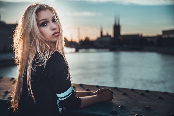Woman with long blonde hair looking at viewer