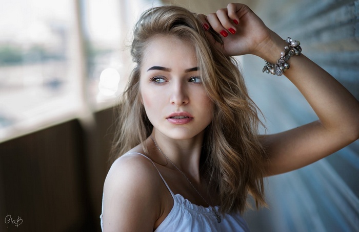 Woman with blonde hair and blue eyes