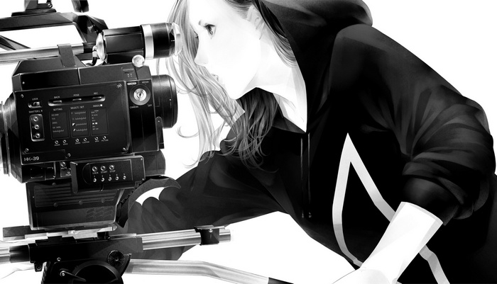 Woman operating a professional video camera