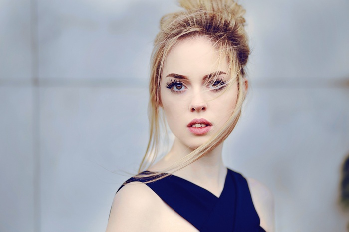 Portrait of a young woman with blonde hair