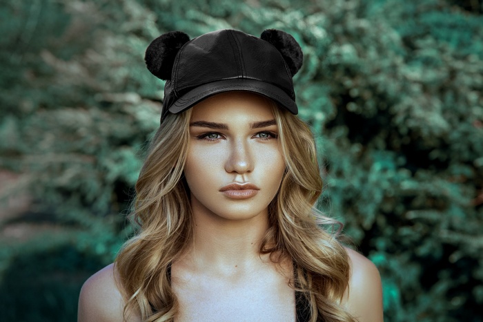 Ania Nesterenko wearing a black baseball cap with ears