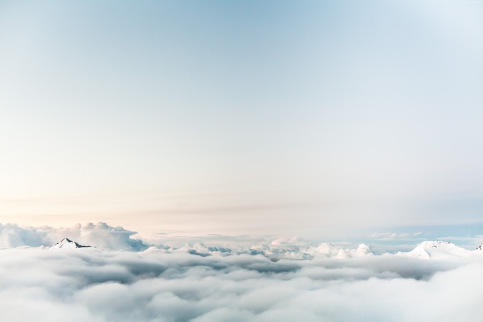 Mountains above the clouds in the sky