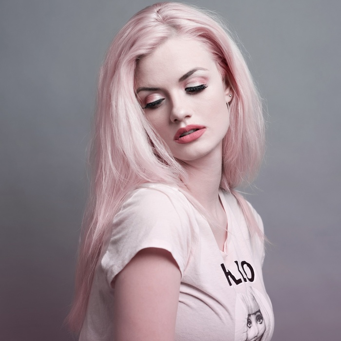 Woman with pink hair and pink lipstick