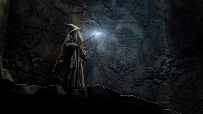 Gandalf in a cave with a glowing staff
