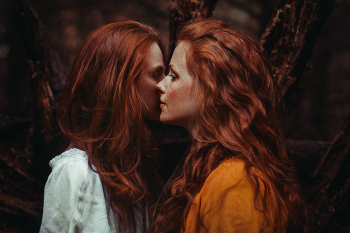 Two red-haired women with freckles in profile
