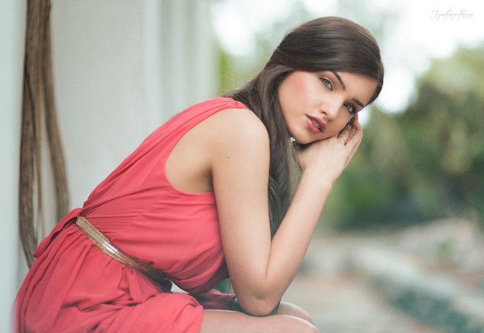 Woman in pink dress with long hair