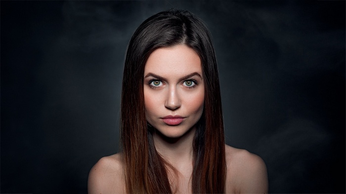 Woman with green eyes and dark hair