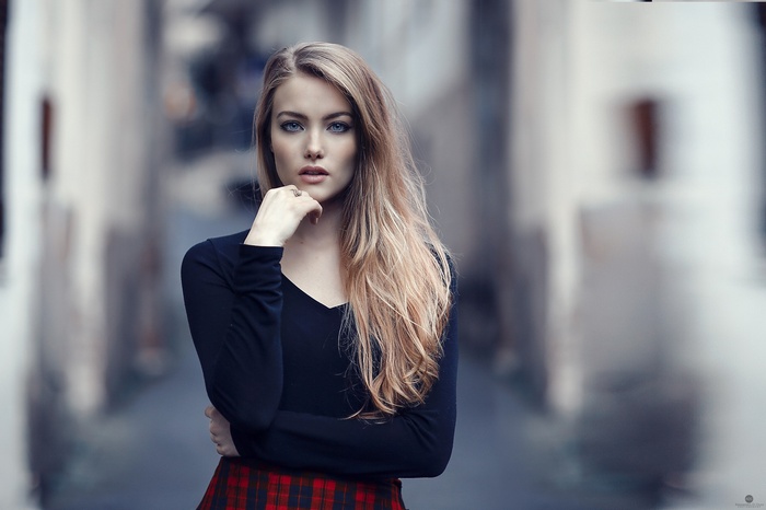 Alessandro Di Cicco blonde model in black top and plaid skirt