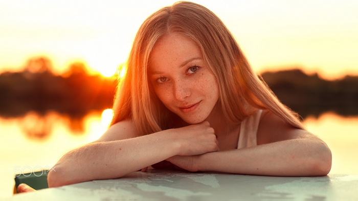Anton Blok portrait of a young woman with freckles at sunset