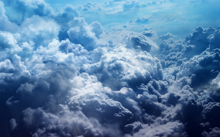 A vast expanse of dramatic clouds from above