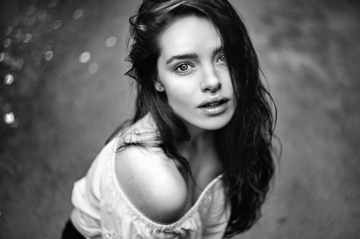 Monochrome portrait of a woman with curly hair