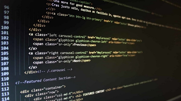 Computer screen displaying HTML code with syntax highlighting