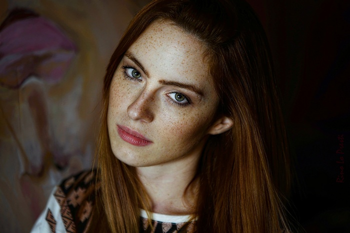 Woman with freckles and red hair