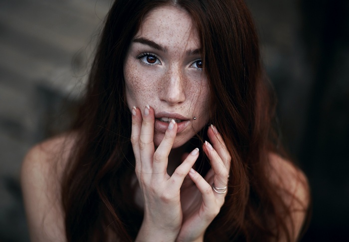 Woman with freckles and lip piercing
