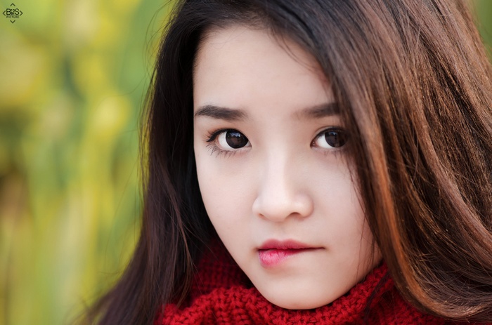 Young Asian woman with red scarf