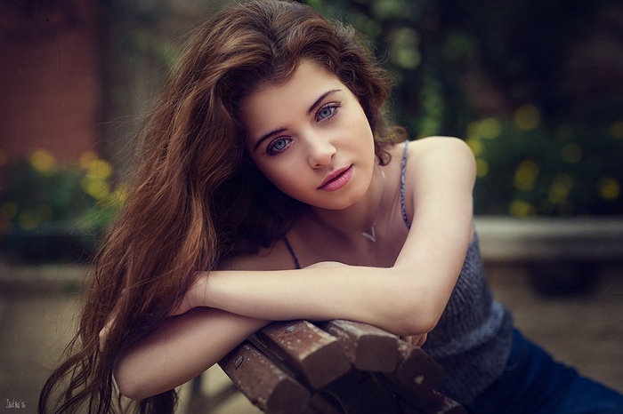 Portrait of a young woman with long brown hair