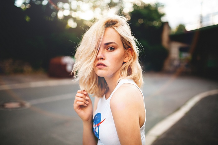 Woman with blonde hair wearing a NASA T-shirt