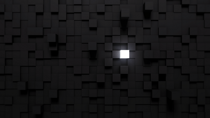 Black cubes with a single glowing white cube