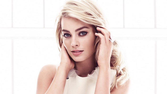 Margot Robbie with blonde hair and blue eyes