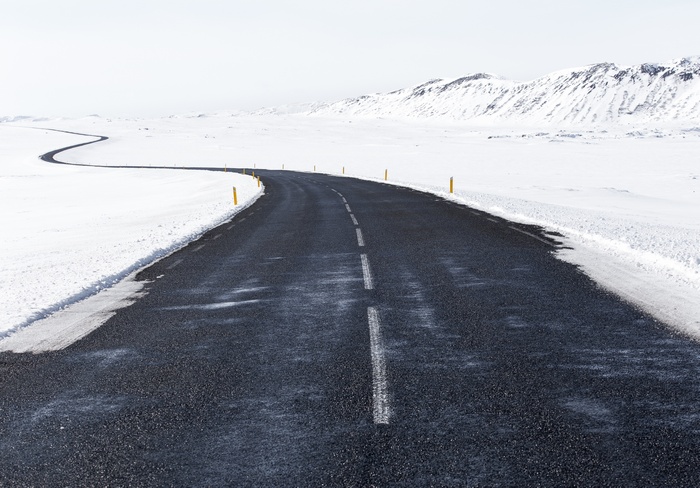 A winding road through a snowy landscape