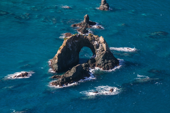 Rock arch formation in the ocean