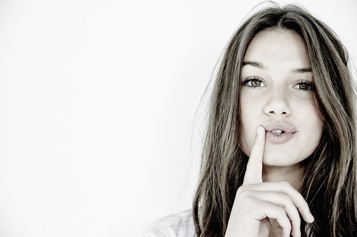 Hailey Outland with finger on lips