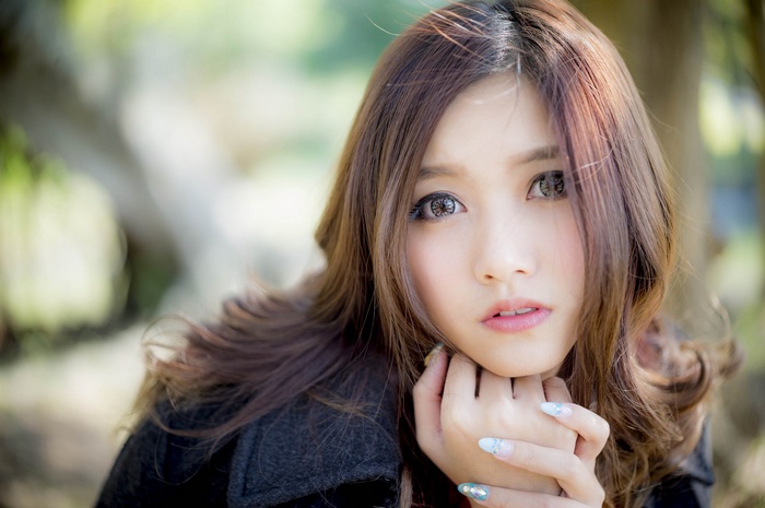 Young Asian woman with long brown hair